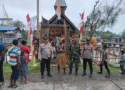 Babinsa Koramil Mapurujaya Hadiri Penyambutan Sekaligus Pengamanan Kedatangan Uskup Timika Di Wilayah Binaan