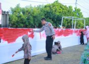Polres Klaten Ajak Anak TK Warnai Kain Merah Putih Sepanjang 80 Meter Sambut HUT RI ke-80